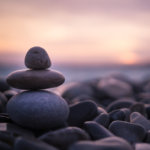 Sunset with pebbles on beach
