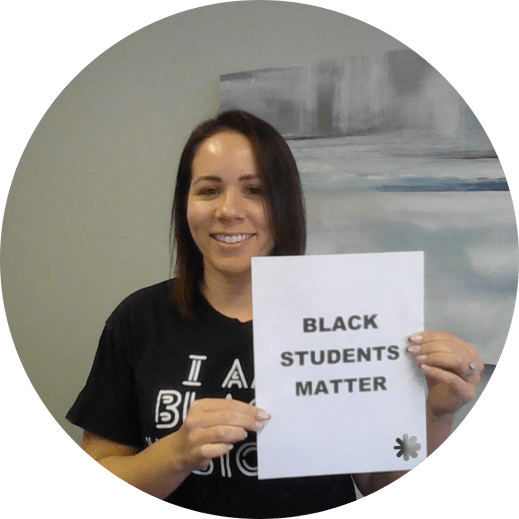 Toni holding a sign - Black students matter